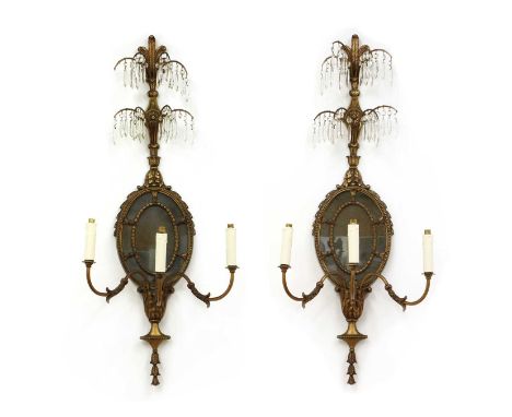 A pair of French-style neoclassical gilt metal three-branch wall lights,each with two tiers of lustres, an oval mirror and le