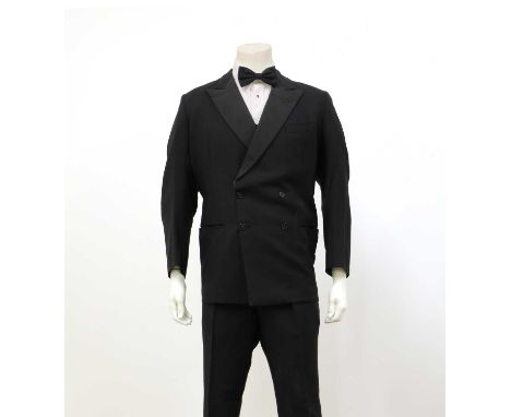 A black double-breasted tuxedoCondition report: By Lesley &amp; Roberts tailors.Good general condition, creases, light marks.