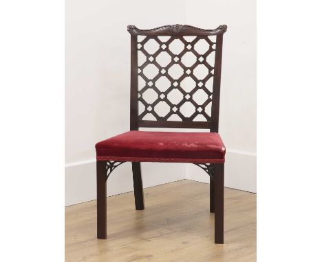 A Chippendale Revival mahogany lattice-back side chair,c.1900, with an overstuffed seat, carved and pierced seat rail bracket