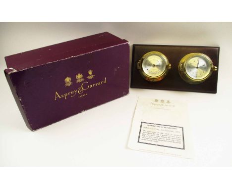 ASPREY &amp; GERRARD CLOCK/BAROMETER, mounted on mahogany board, 38.5cm W x 21cm H max., together with a certificate of guara
