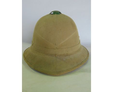 An antique military pith helmet, canvas lined, numbered to interior, aperture width measuring 6 cm  approx