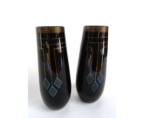 A pair of amethyst Studio Glass vases of tapering cylindrical form each with gilded borders and medallion detail in shades of