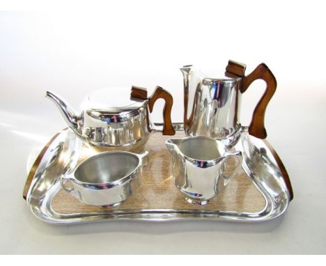 A five piece Piquot ware tea set comprising teapot, hot water pot, milk jug and sugar basin presented on an associated tray