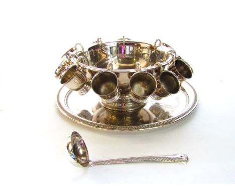 A contemporary silver plated punch bowl with embossed border together with an associated ladle and twelve punch cups also tog