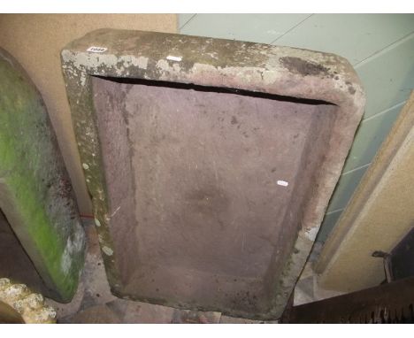 A shallow natural stone trough of rectangular form, 77 x 54 cm approx