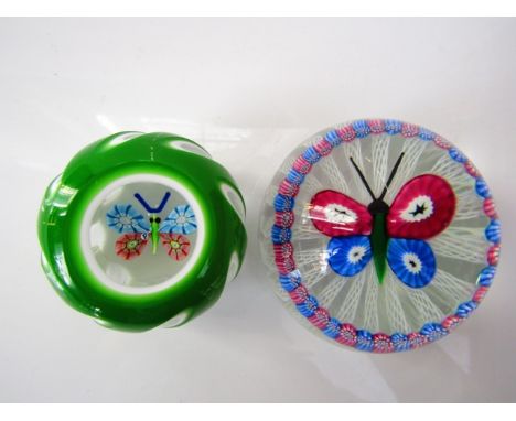 A Millefiori glass paperweight by John Deacons with central butterfly study set upon a bed of white Latticino canes with a co