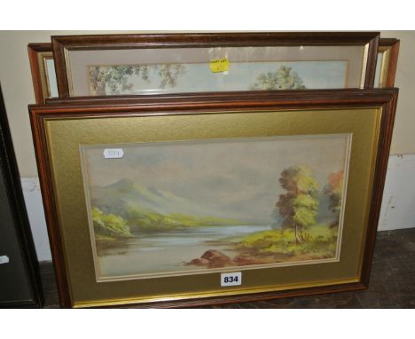 A pair of early 20th century watercolours, one of a coastal scene, the other a mountainous lake scene, both signed bottom rig