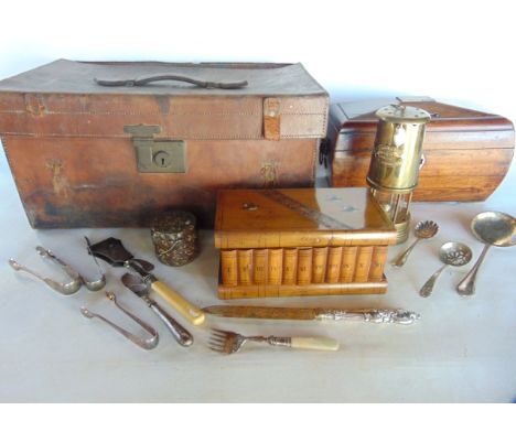 A stitched brown leather case containing a 19th century sarcophagus shaped veneered tea caddy, a Sorrento ware box, a lidded 