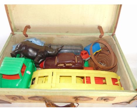 A stitched canvas trunk initialled R L Cook, marked to interior F Ltd 1945, containing a selection of children's vintage toys