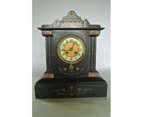 A polished black slate mantle clock of architectural form with 8 day striking movement