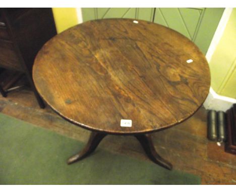 A substantial Georgian elm snap top table, the circular top raised on a vase shaped pillar and tripod base, together with a p