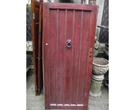 A heavy oak front door with moulded detail, iron fittings and lions mask and ring knocker together with three further interna