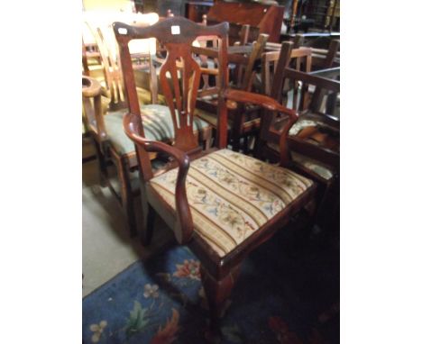 A Georgian open elbow chair with central pierced vase shaped splat over a drop in tapestry seat raised on cabriole forelegs