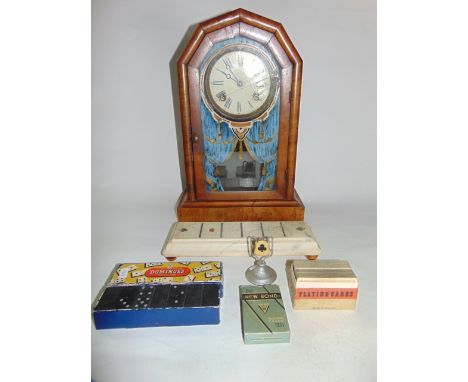 An American type mantle clock of canted arched form with glazed panelled door with painted garland curtain aperture together 