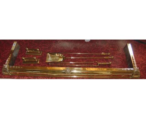 A good quality 19th century polished brass fire kerb with applied finials and further detail together with a small pair of fi