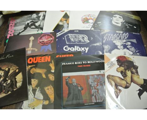 A large collection of vintage vinyl albums, including Mott the Hoople, Monty Python, Isley Brothers, The Who, T-Rex, Clash, B