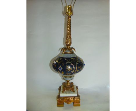 A highly decorative desk lamp, possibly retailed by Gimbels, the blue glass bowl decorated with gilded and applied cut stone 