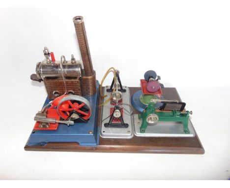 A 20th century stationary engine assembly, with an assembly of further wheel driven components bearing label reading Wilesco,