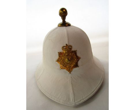 A Royal Marine white pith dress helmet with applied gold coloured Gibraltar badge (possibly with later painted finish), the i