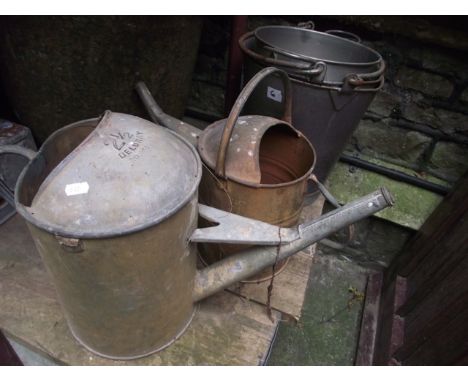Two vintage steel pails with loop handles, one labelled Lister, Dursley, made in England, together with two galvanised wateri