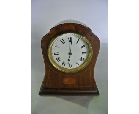 An inlaid Edwardian mahogany mantle clock with enamelled dial and 8 day timepiece