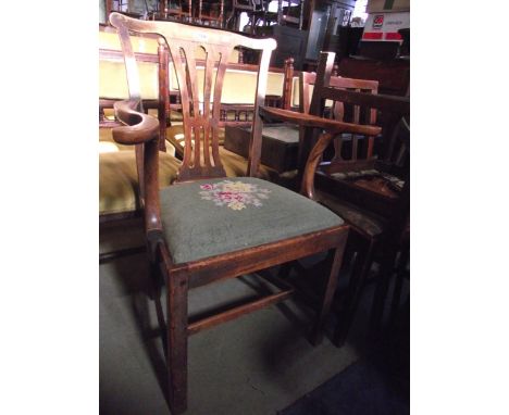 A Georgian Chippendale style open elbow chair with central pierced splat, swept arms, drop in floral tapestry seat and raised