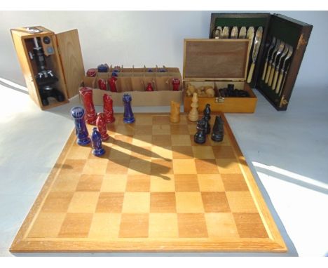 A miscellaneous collection to include a ceramic chess set with associated timber chess board, a small timber cased microscope