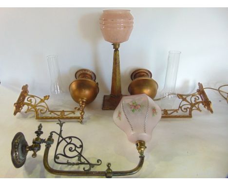 A desk lamp in the Art Deco manner of obelisk form supporting a mottled pink and gilded shade together with a pair of gold co