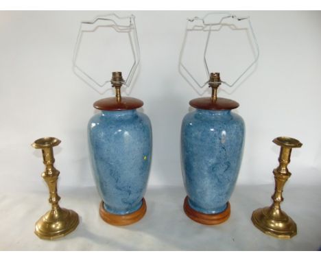 A pair of blue glazed ceramic vase desk lamps, of baluster form, with timber bases, together with a pair of brass candlestick