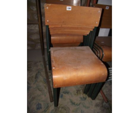 A set of six vintage green painted tubular steel framed child's school stacking chairs with moulded plywood seats and back ra