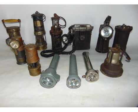 Antique lighting to include a heavy iron and brass mounted miner's lamp, a further lamp stamped Ceag 2 Volt Standard Lamp, fu