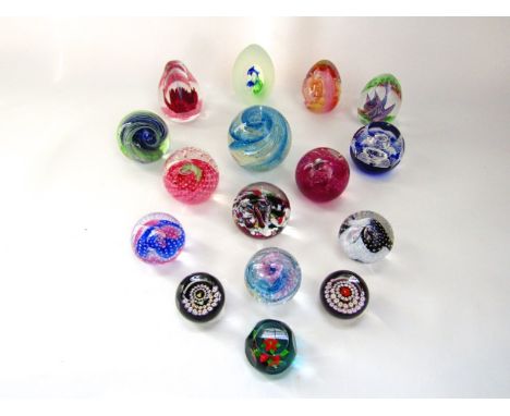 A collection of approximately fourteen boxed Caithness paperweights with models to include Fantasy Orchid, Pyrotechnics, Fana