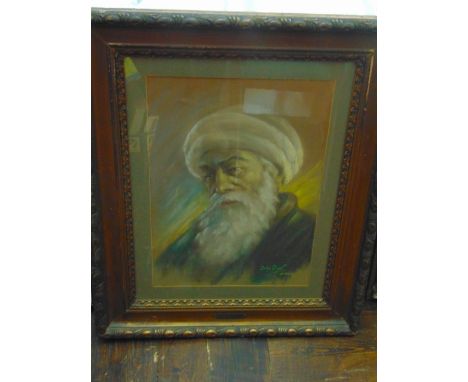 An early 20th century pastel bust length portrait of an elderly bearded man in a turban, signed bottom right Dafni Poiret, da