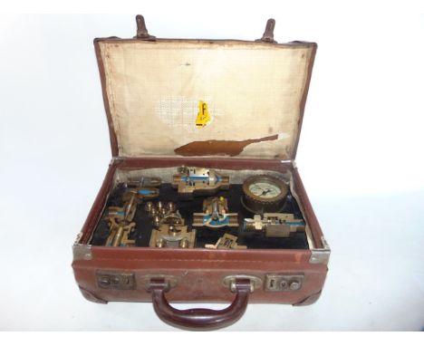 An unusual miniature reinforced travelling trunk containing an assembly of tradesman's demonstration/display works displaying