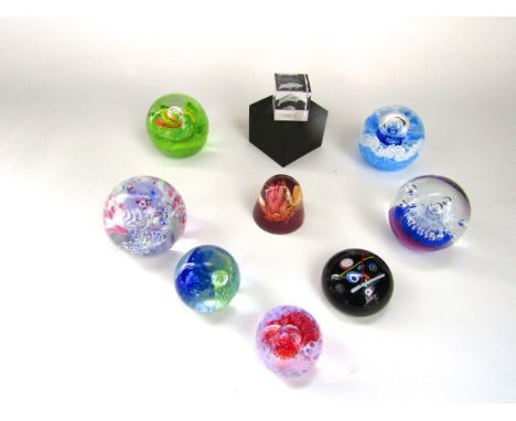 A small collection of Caithness glass paperweights to include six boxed examples including Wheel of Fortune, Rolling Surf Dol