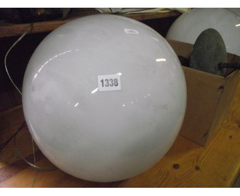 A set of four vintage opaque glass hanging ceiling lights of sphere form (complete with fittings)