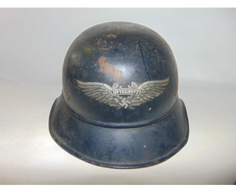 A German Third Reich Luftschutz helmet bearing original decal to front, stickered to interior reading Vertrieb Genehmigt Luft
