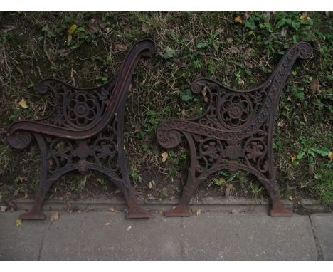 A pair of reproduction cast iron bench ends with pierced foliate and further detail, together with a quantity of vintage and 