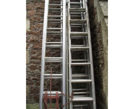 A pair of contemporary aluminium sixteen rung and extending aluminium ladders together with two others (smaller) and four ass