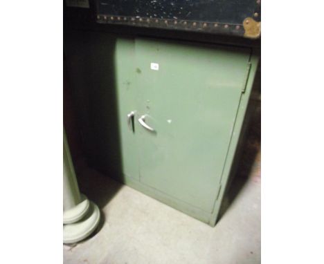 A green painted steel office/side cabinet enclosed by a pair of doors, the interior with single adjustable shelf