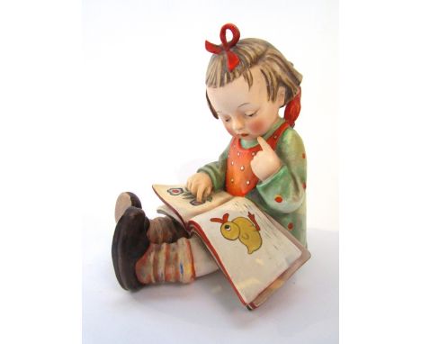 An unusual outsized Goebel figure of a little girl reading a book - Bookworm, with paper label to base Trentham Art Ware Seri