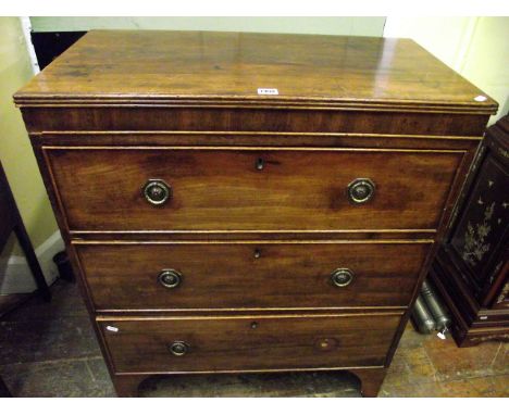 An unusually small Regency mahogany caddy top chest of three long drawers on swept supports, 77 cm wide