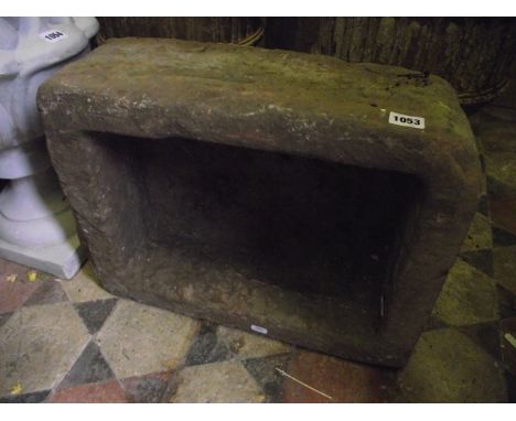 A small natural stone trough of rectangular form  52 x 38 cm approx