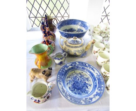 A collection of mainly 19th century ceramics, including an early 19th century blue and white Willow pattern punch bowl, furth