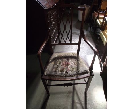 A vintage child's oak elbow chair with vertical slats over a drop in seat raised on splayed supports, together with an inlaid