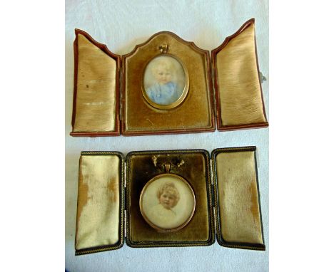 An early 20th century watercolour miniature portrait of oval form showing a fair haired child in a blue romper suit, with loc