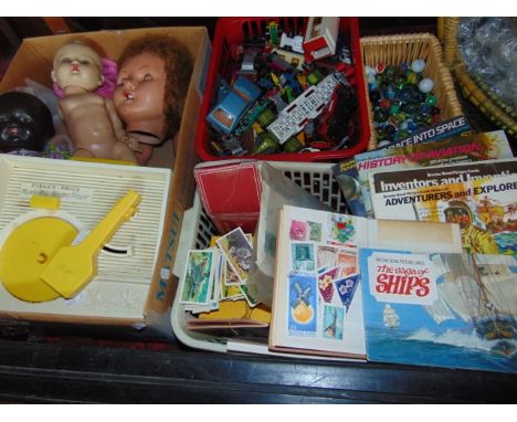 A miscellaneous collection featuring toys to include a box of unboxed Corgi and other die cast model vehicles, a Fisher-Price