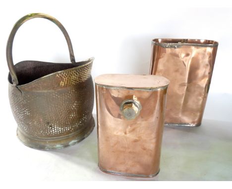 A collection of antique metal wares to include a good quality copper coal scuttle with looping handle, a further beaten examp