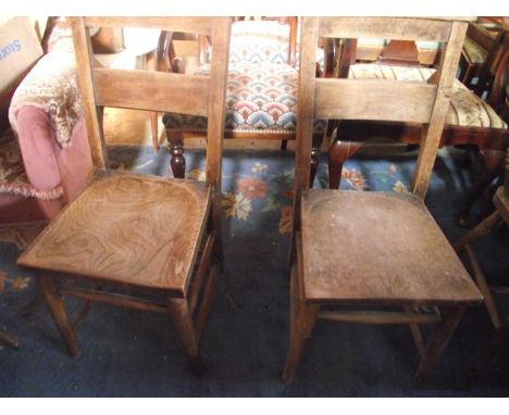 Three vintage elm and beech wood chapel chairs with saddle shaped seats and hymn book receptacles
