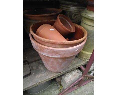 A vintage cast iron tub, a reclaimed buff coloured chimney pot of squat cylindrical form,  a terracotta dairy pan, a large co